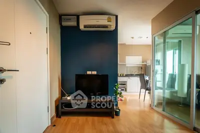 Modern living room with TV and air conditioning in stylish apartment