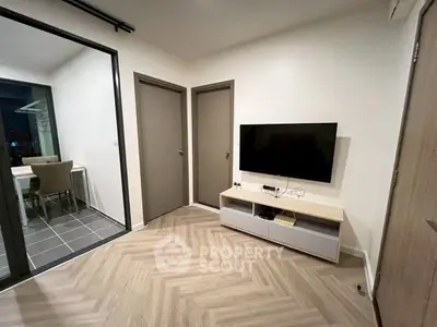 Modern living room with sleek TV setup and balcony view