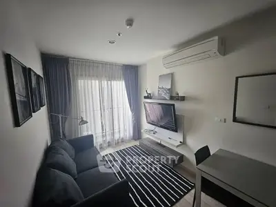 Modern living room with sleek furniture and natural light, featuring a cozy sofa and wall-mounted TV.