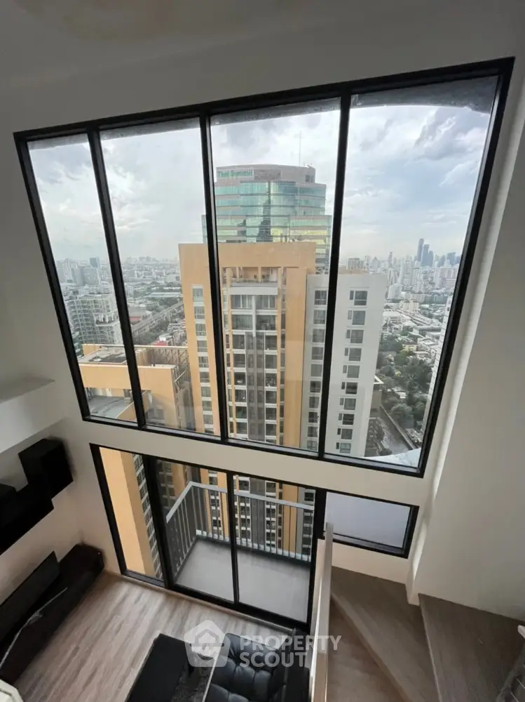 Stunning high-rise apartment with floor-to-ceiling windows and breathtaking city view