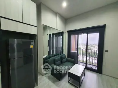 Modern living room with balcony and city view, featuring sleek furniture and natural light.