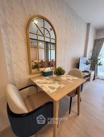 Stylish dining area with elegant decor and modern furniture in a cozy apartment.