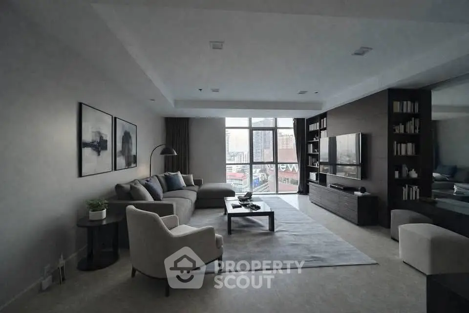 Spacious modern living room with large windows and stylish decor