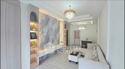 Elegant living room with luxurious chandeliers and modern decor