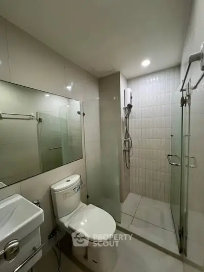 Modern bathroom with glass shower and sleek fixtures