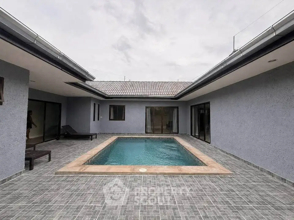 Modern courtyard home with private pool and sleek design, perfect for luxury living.