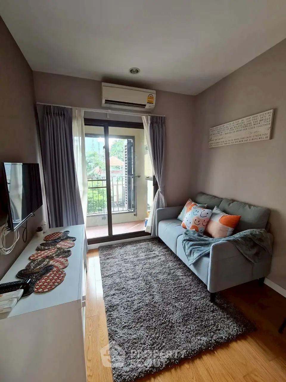 Cozy living room with balcony access and modern decor