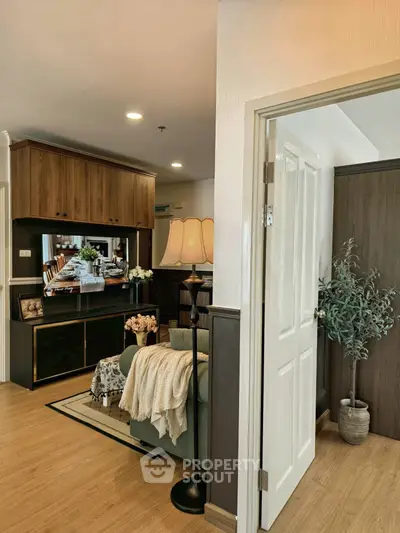 Cozy living room with elegant decor and warm lighting, perfect for relaxation and entertainment.