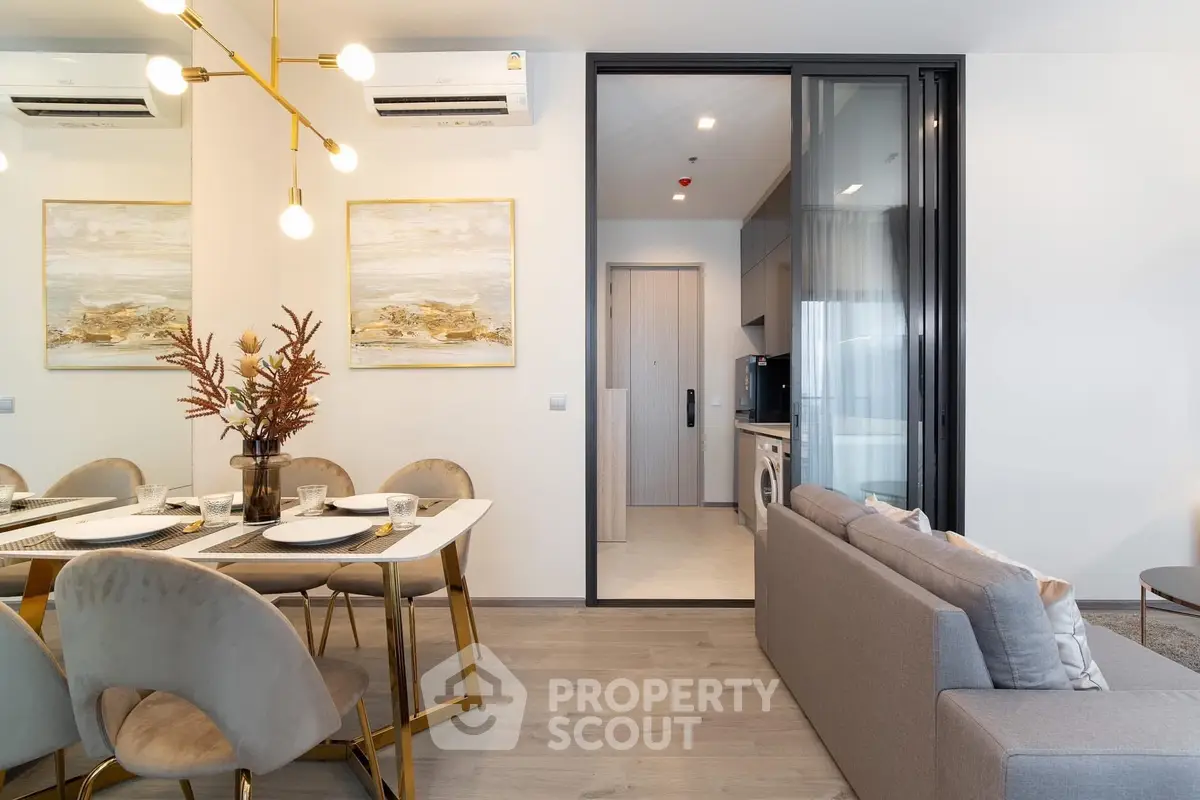 Modern open-plan living and dining area with elegant decor and natural light