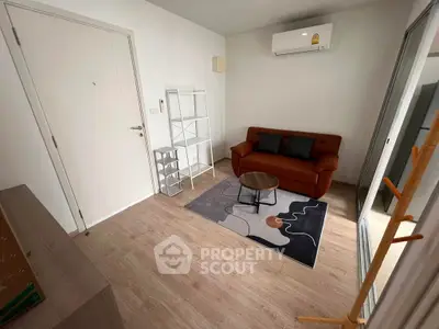 Cozy living room with modern sofa and air conditioning in a compact apartment