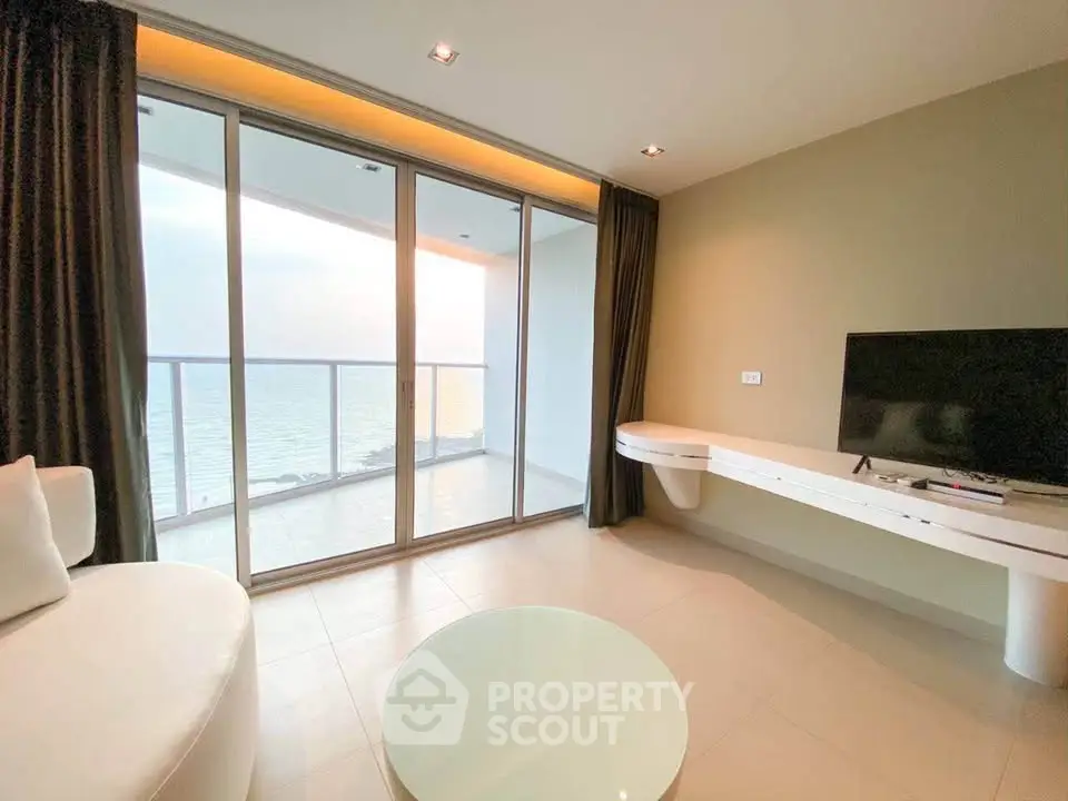 Modern living room with ocean view and sleek furniture
