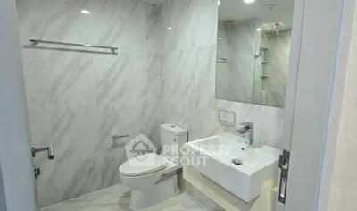 Modern bathroom with sleek fixtures and elegant marble tiles