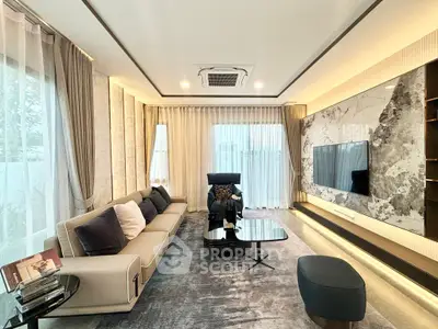 Luxurious modern living room with elegant decor and large windows for natural light.