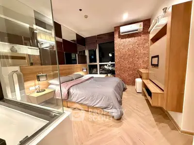 Modern bedroom with stylish brick accent wall and cozy lighting