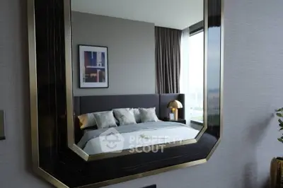 Luxurious modern bedroom with large mirror and elegant decor