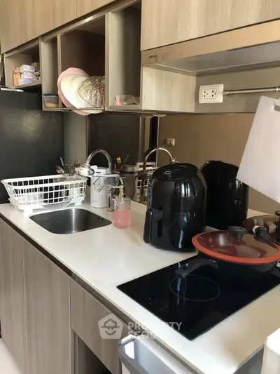 Modern kitchen with sleek appliances and efficient storage solutions.