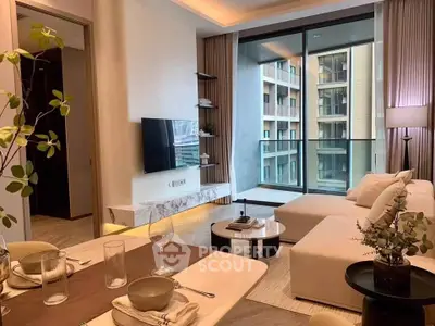 Modern living room with elegant decor and large balcony view in luxury apartment.