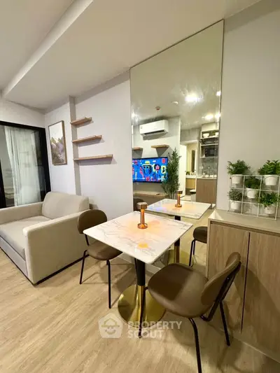 Modern living room with stylish dining area and open kitchen layout