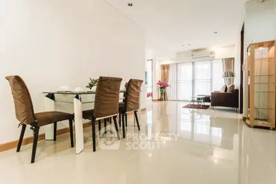 Spacious modern living room with elegant dining area and natural light