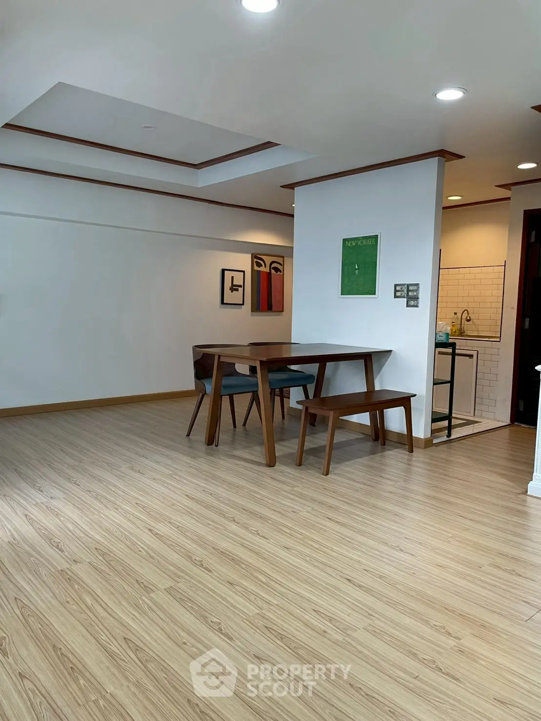 Modern dining area with wooden flooring and stylish furniture