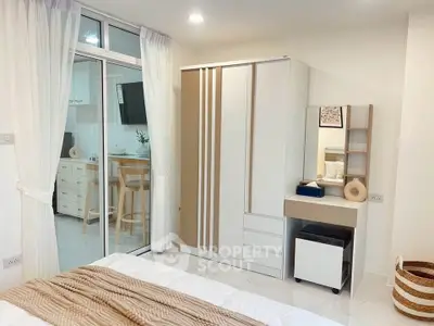Modern bedroom with stylish wardrobe and cozy decor in a contemporary apartment.