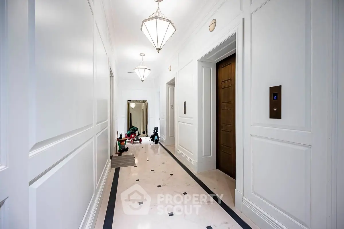 Elegant hallway with modern elevators and stylish lighting fixtures