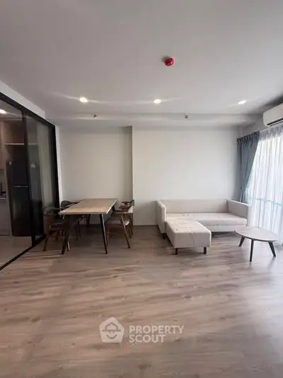 Spacious modern living room with elegant furniture and natural light