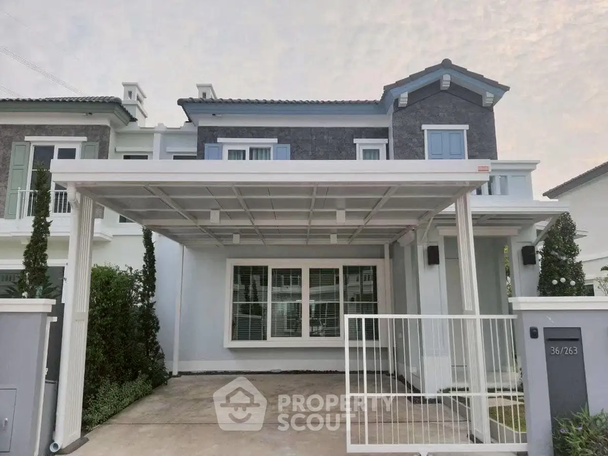 Modern two-story house with covered carport and stylish facade