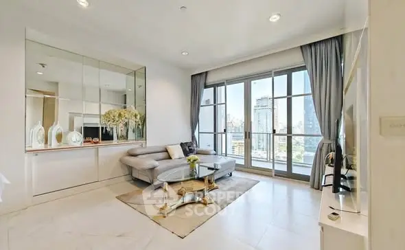 Luxurious living room with city view, elegant decor, and floor-to-ceiling windows in modern apartment.