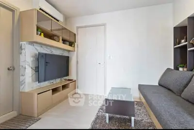 Modern living room with sleek furniture and built-in TV unit, perfect for urban living.