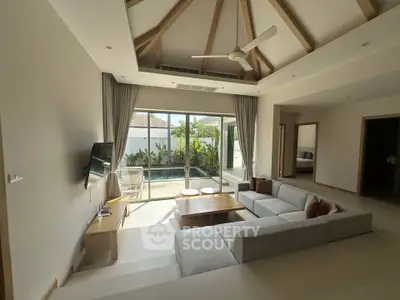 Spacious living room with pool view and modern decor
