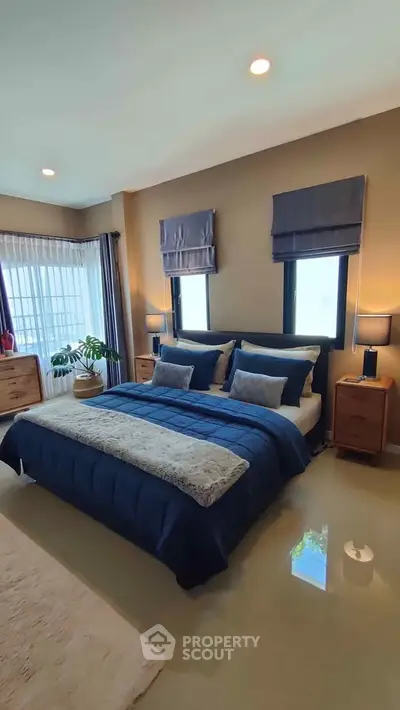 Luxurious bedroom with elegant decor and natural light