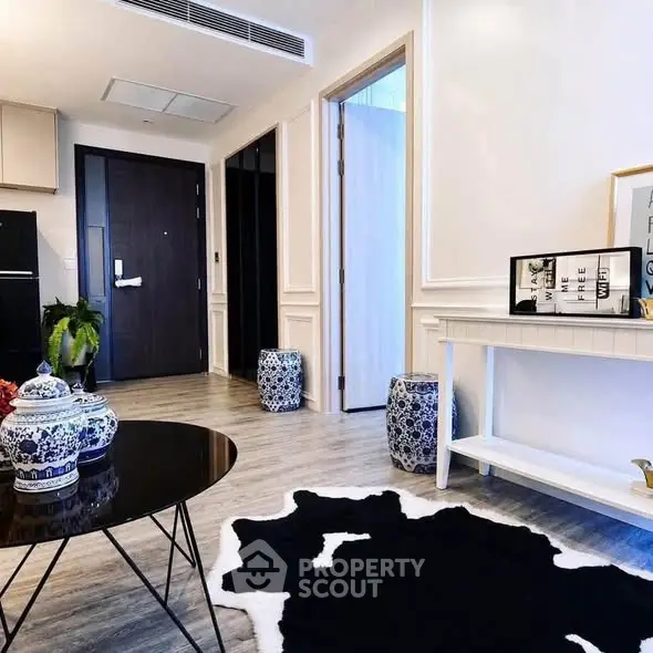 Stylish modern living room with elegant decor and unique rug
