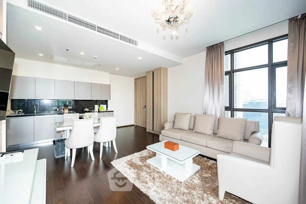 Luxurious open-plan living room with modern kitchen and elegant furnishings