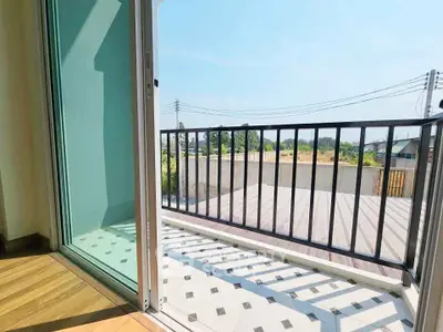 Spacious balcony with scenic view and modern railing design