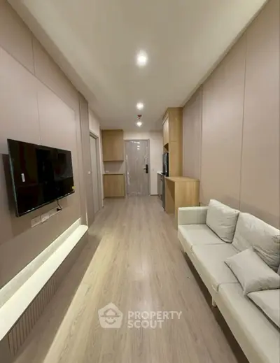 Modern living room with sleek design and cozy sofa in a stylish apartment.