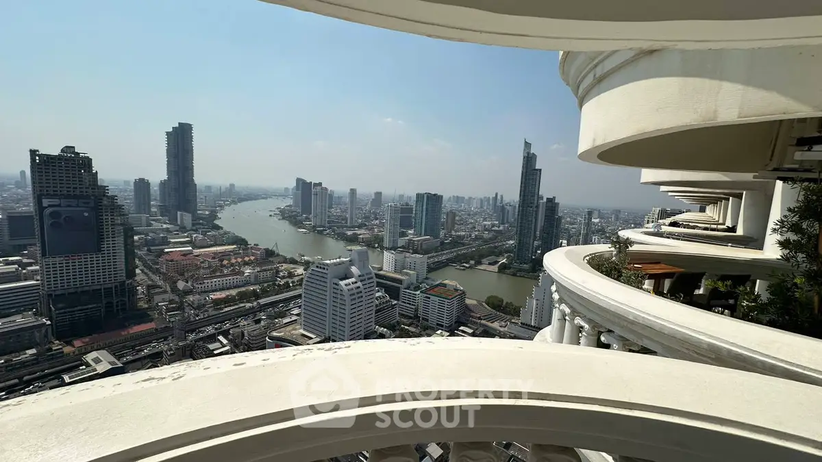 Stunning cityscape view from high-rise balcony overlooking river and skyline