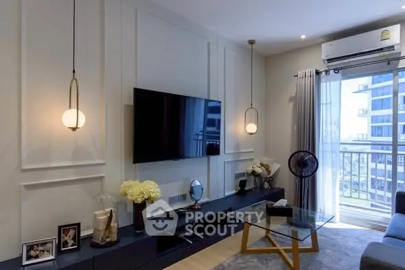 Modern living room with stylish decor and balcony view