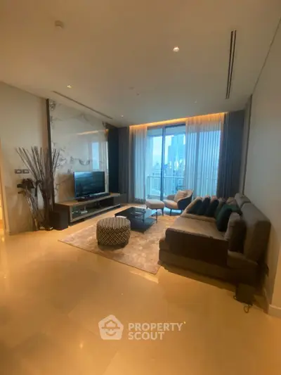 Luxurious living room with modern decor and stunning city view, featuring a cozy seating area and elegant lighting.