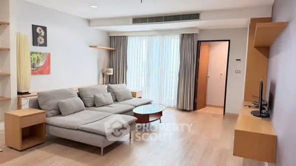 Spacious modern living room with stylish decor and natural light