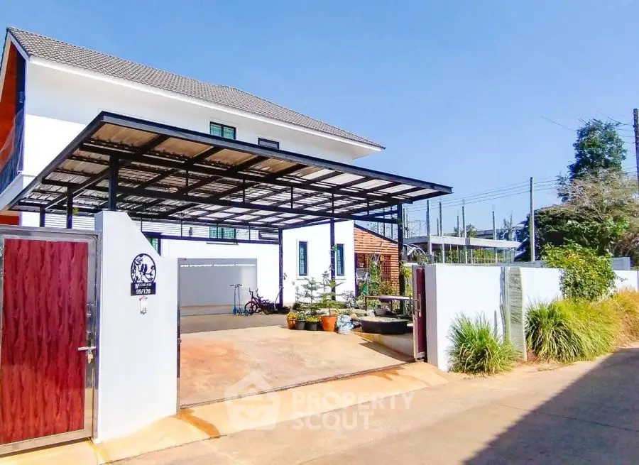 Modern two-story house with spacious driveway and carport in sunny neighborhood.