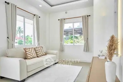 Bright and airy living room with modern decor and large windows