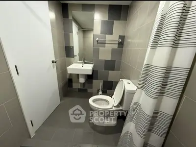 Modern bathroom with sleek tiles and contemporary fixtures