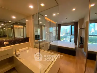 Luxurious modern apartment with glass-walled bathroom and stunning city view