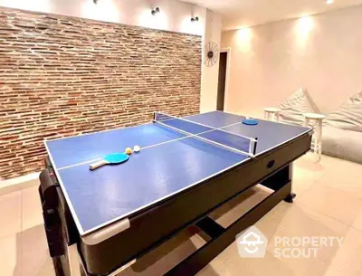 Stylish recreation room with ping pong table and modern decor