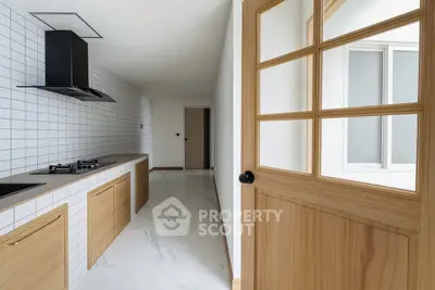 Modern kitchen with sleek design and gas stove in minimalist apartment