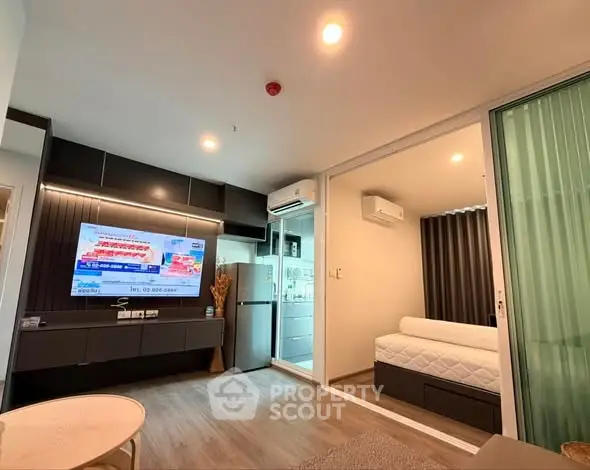 Modern living room with sleek design and cozy bedroom view