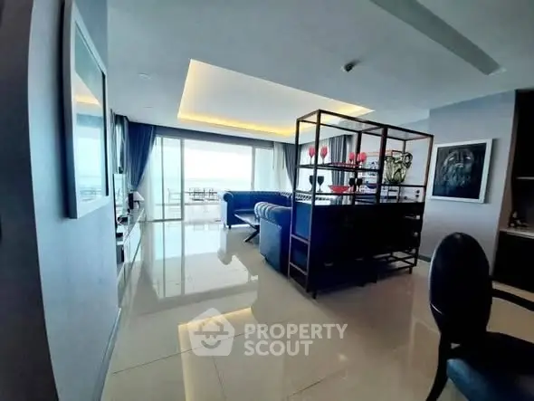 Spacious modern living room with elegant decor and large windows offering stunning views.