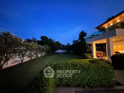 Luxurious modern home with spacious garden and stunning evening view