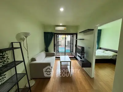 Modern living room with balcony access and stylish decor